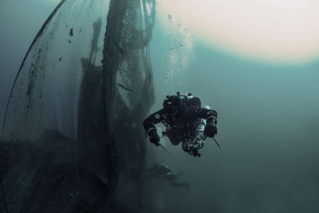 Divers retrieving ghost nets 