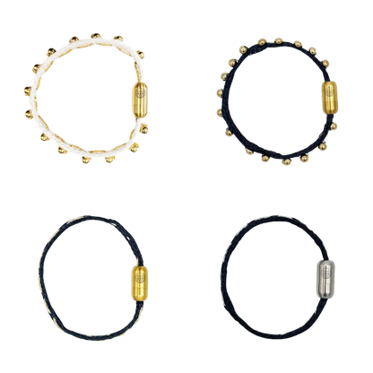 Alle Produkte der BRACENET Glam Edition. Oben links das Armband aus weißem Fischernetz mit goldenen Perlen und goldenem Magnet Verschluss. Oben recht das Armband aus schwarzem Netz mit goldenen Perlen und goldenem Magnetverschluss. Unten links das Armband aus schwarzem Fischernetz mit goldenem Faden durchzogen und goldenem Magnetverschluss. Unten rechts das Armband aus schwarzem Fischernetz mit silbernem Faden durchzogen und silbernem Magnetverschluss.
