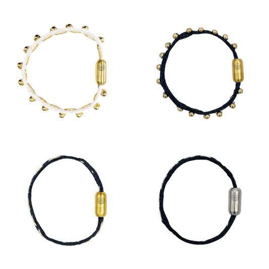 Alle Produkte der BRACENET Glam Edition. Oben links das Armband aus weißem Fischernetz mit goldenen Perlen und goldenem Magnet Verschluss. Oben recht das Armband aus schwarzem Netz mit goldenen Perlen und goldenem Magnetverschluss. Unten links das Armband aus schwarzem Fischernetz mit goldenem Faden durchzogen und goldenem Magnetverschluss. Unten rechts das Armband aus schwarzem Fischernetz mit silbernem Faden durchzogen und silbernem Magnetverschluss.
